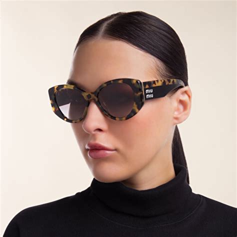 Miu Miu Irregular Sunglasses .